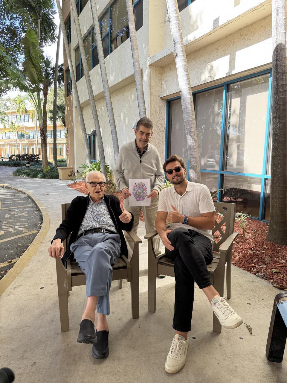 Tyler Pasko with his grandfather and uncle outside the community where he placed them